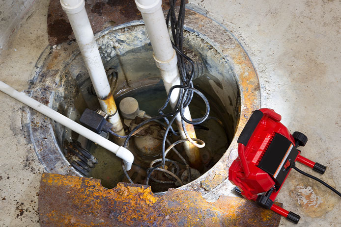 Work light shining on sump pump