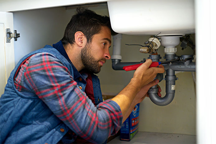 Guy working on a sink