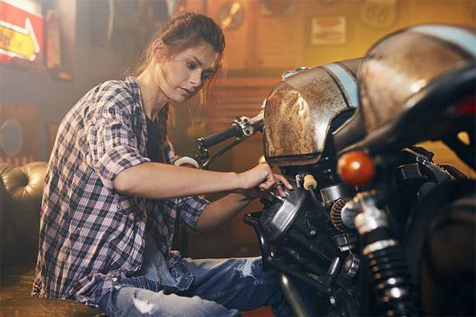 Woman fixing bike