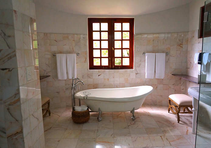 Bathroom with storage in medicine cabinet and shelf above toilet